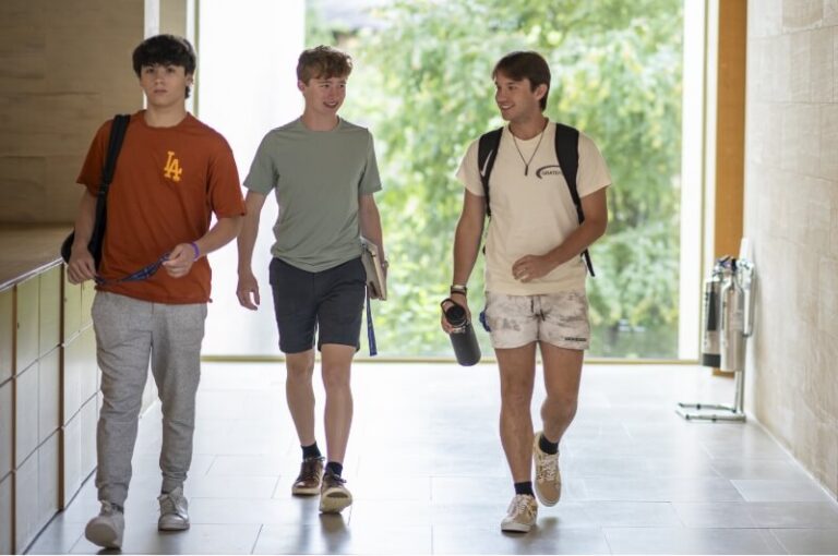 students-walking-campus-hall