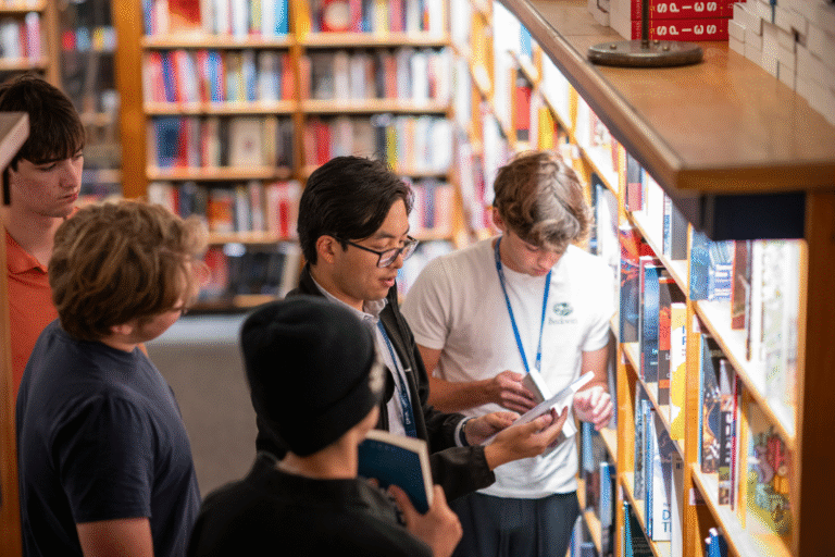 Three students listen to a lecture