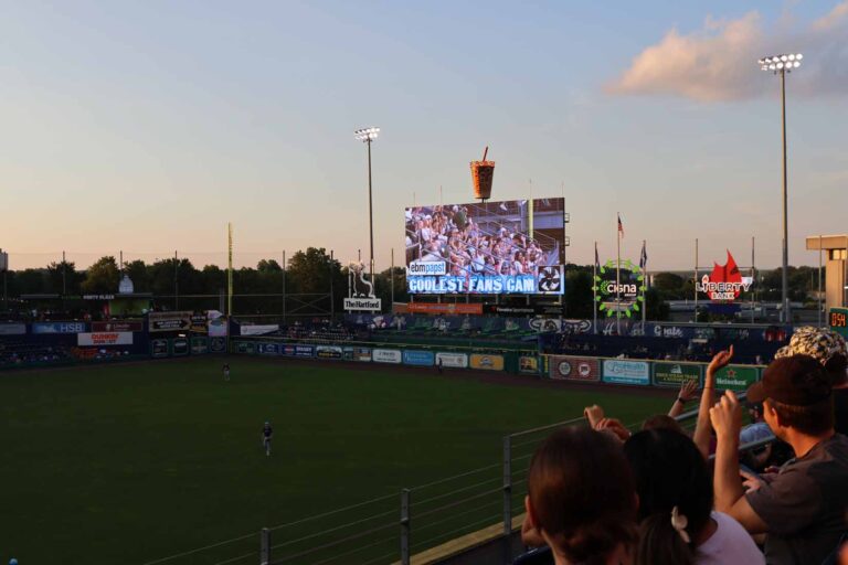 Image of stadium with screen readind "Coolest Fan Cam"