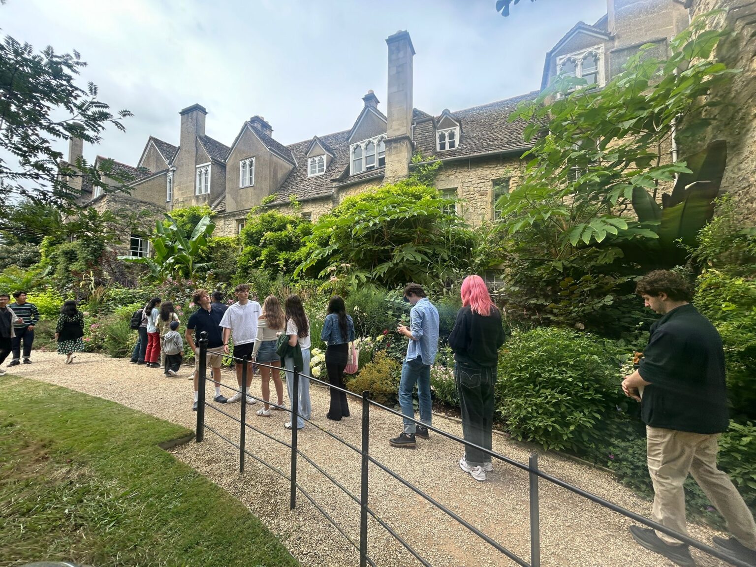 Students walk in line through the green on Oxford campus green