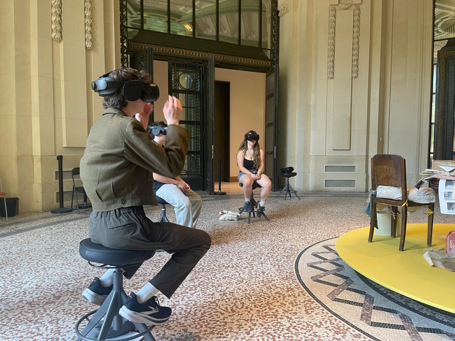 Two students wear virtual reality googles as part of display at the Grand Palais