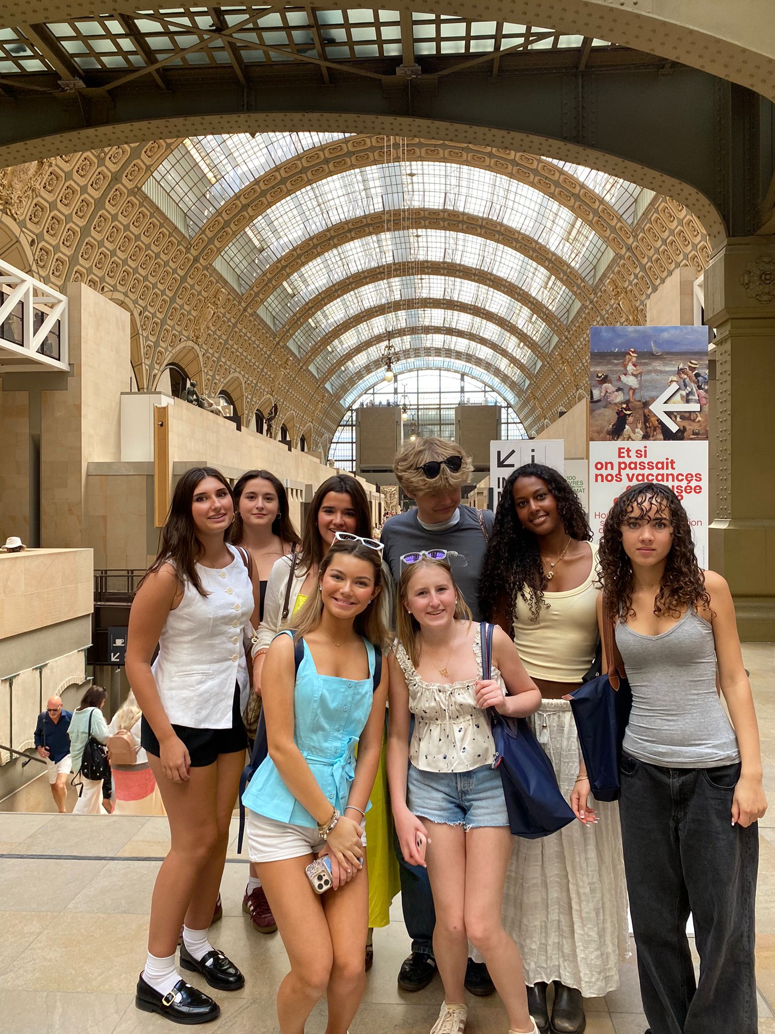Group of students pose for a group photo in the Musée d’Orsay
