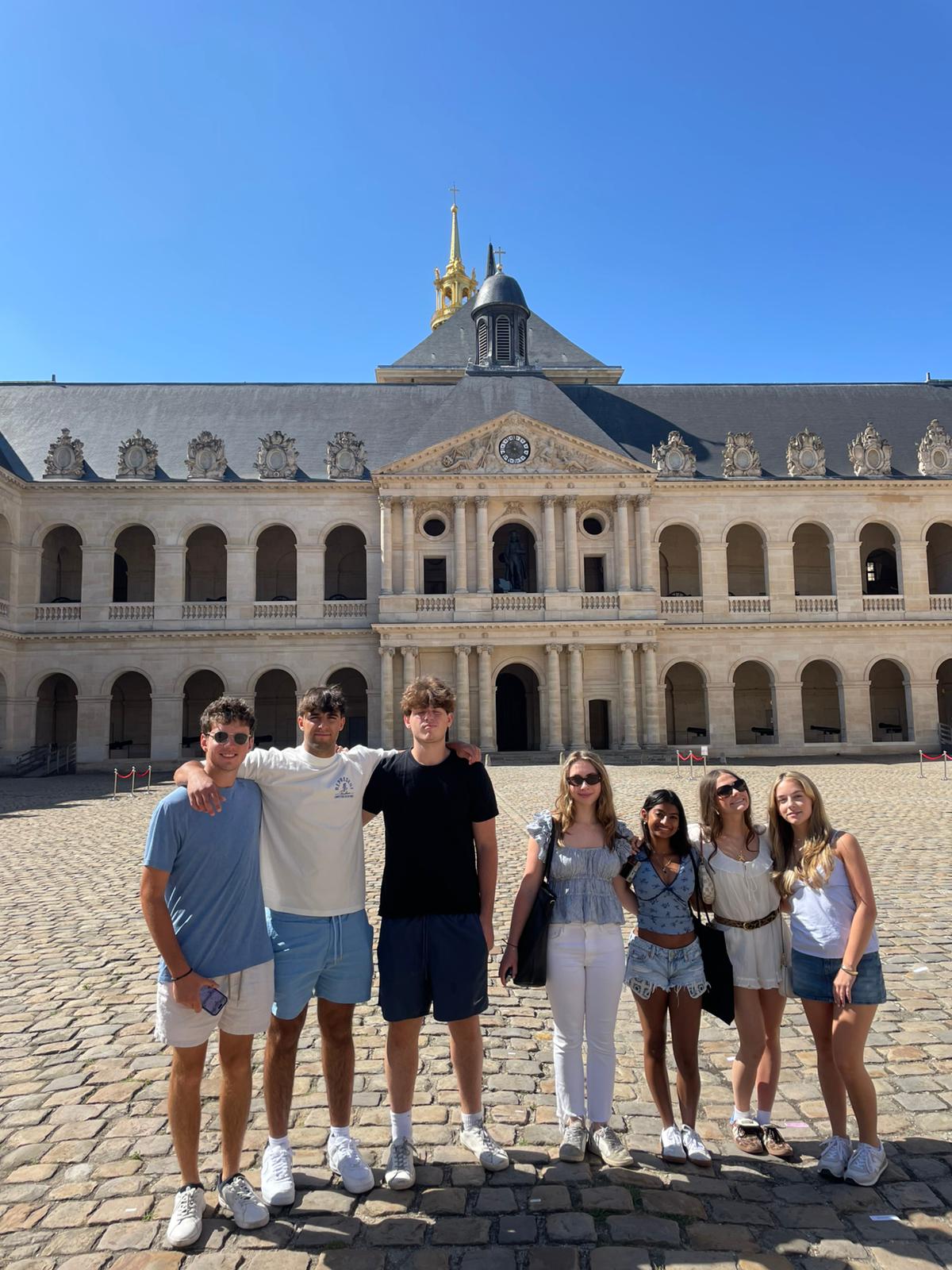 Students pose for a group photo at Les Invalides