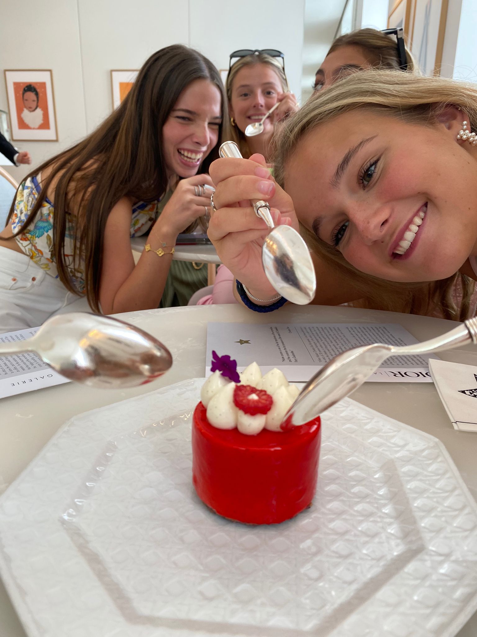 Students excitedly dig spoons into dessert